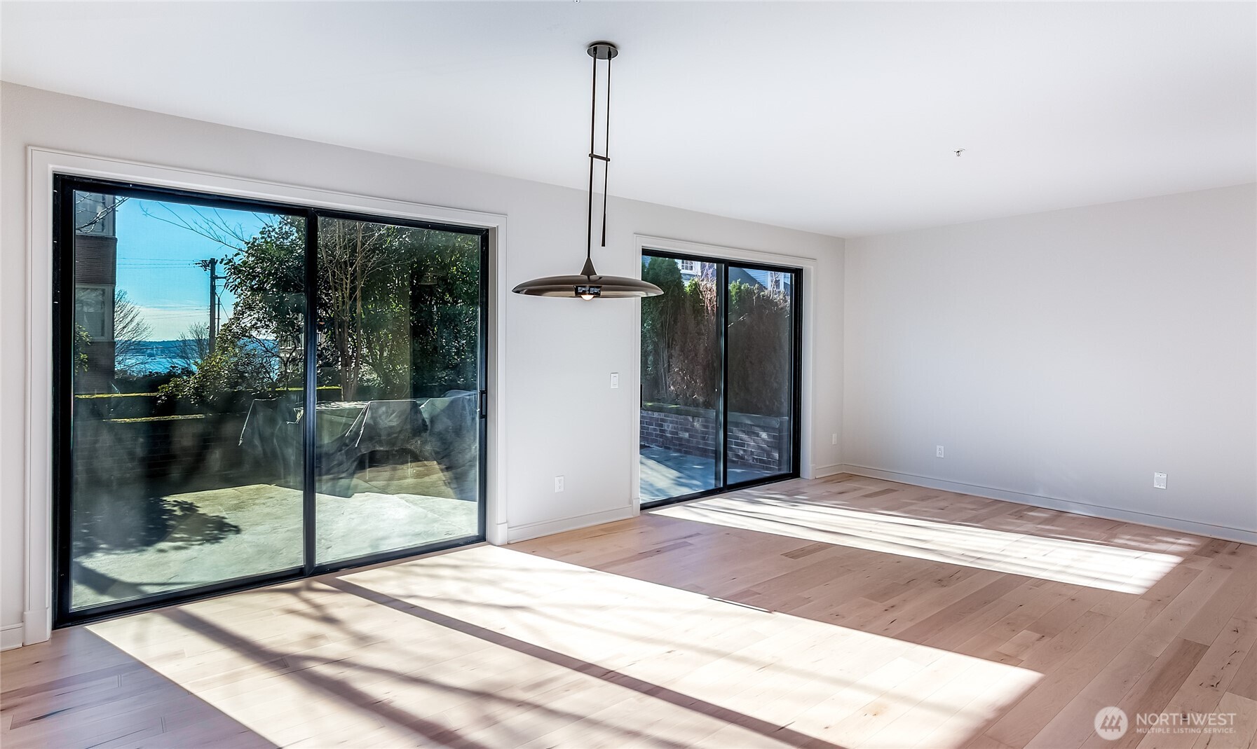 21 West Comstock Street, Unit 102 Seattle, WA 98119 - Photo 7 of 22 a view of a room with a floor to ceiling window