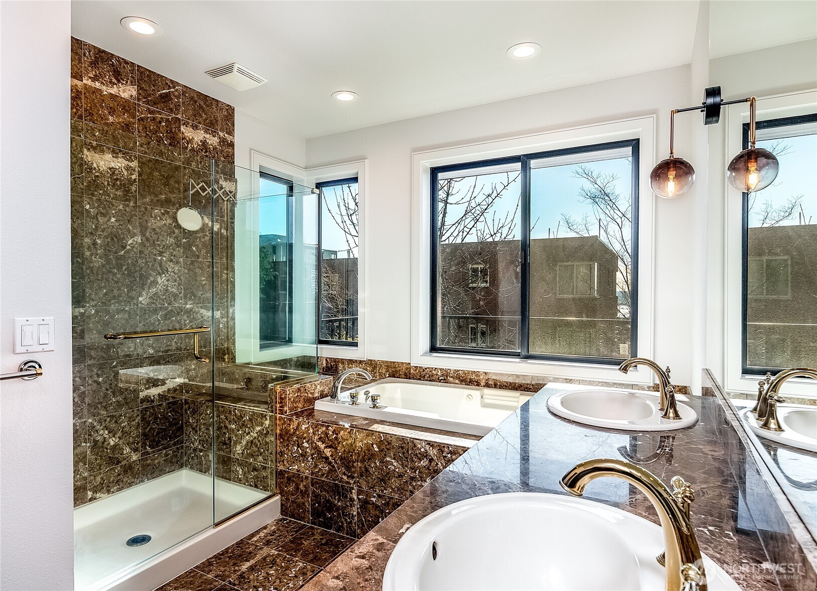 21 West Comstock Street, Unit 102 Seattle, WA 98119 - Photo 9 of 22 a bathroom with a granite countertop sink and a mirror