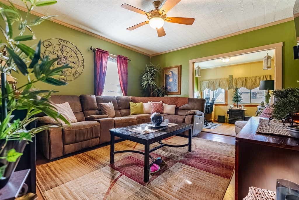 3853 North Main Street Fall River, MA 02720 - Photo 13 of 38 a living room with furniture and a large window