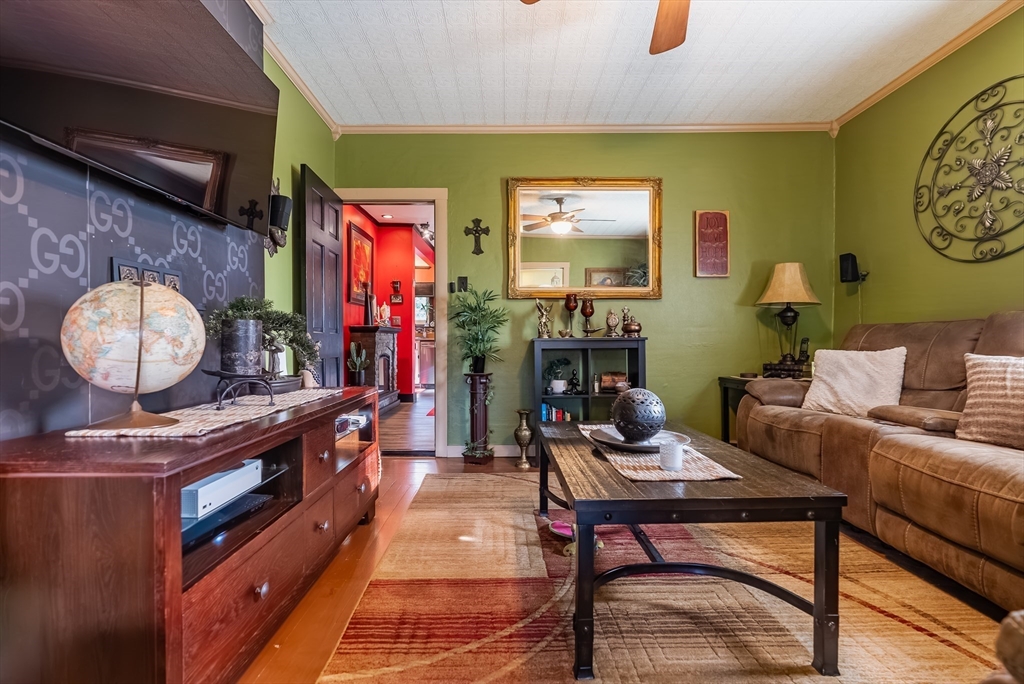 3853 North Main Street Fall River, MA 02720 - Photo 14 of 38 a living room with furniture and a flat screen tv