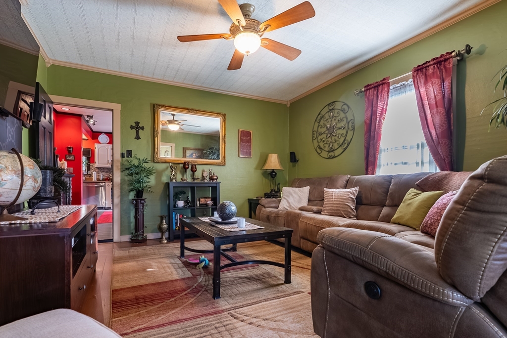 3853 North Main Street Fall River, MA 02720 - Photo 15 of 38 a living room with furniture a flat screen tv and a window