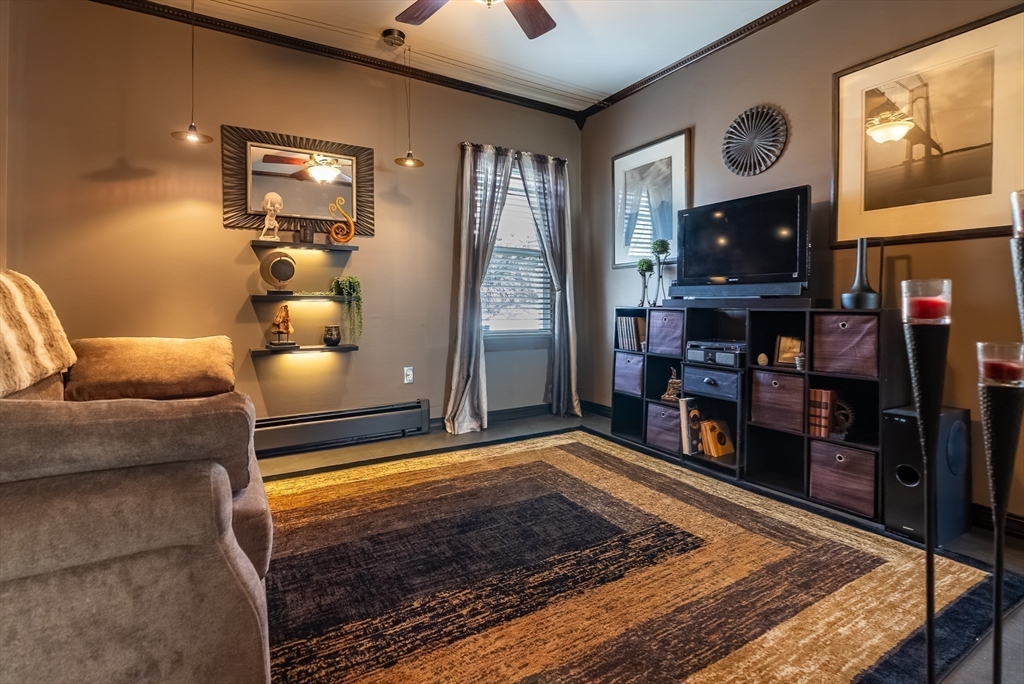 3853 North Main Street Fall River, MA 02720 - Photo 16 of 38 a living room with furniture and a fireplace