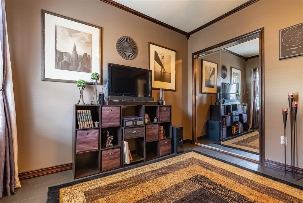 3853 North Main Street Fall River, MA 02720 - Photo 17 of 38 a living room with furniture and a flat screen tv