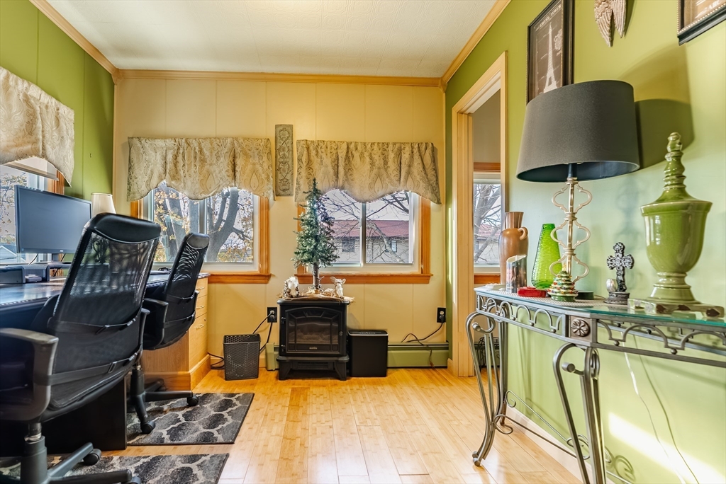 3853 North Main Street Fall River, MA 02720 - Photo 18 of 38 a living room with furniture and a flat screen tv