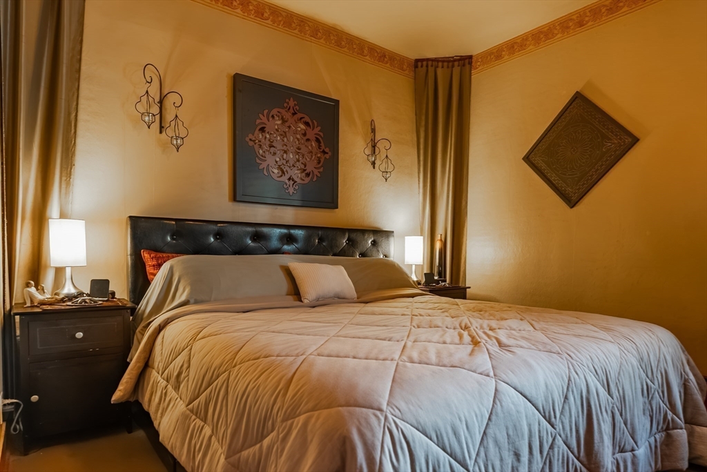 3853 North Main Street Fall River, MA 02720 - Photo 21 of 38 a bedroom with a bed and painting on the wall