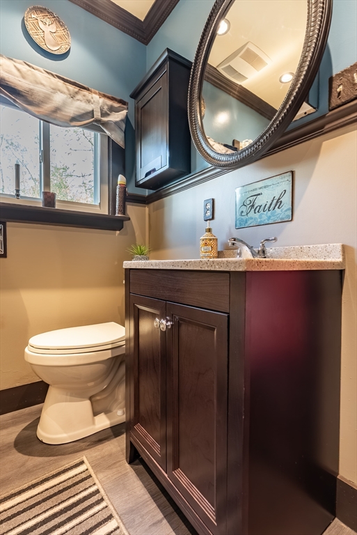 3853 North Main Street Fall River, MA 02720 - Photo 24 of 38 a bathroom with a toilet a sink and mirror
