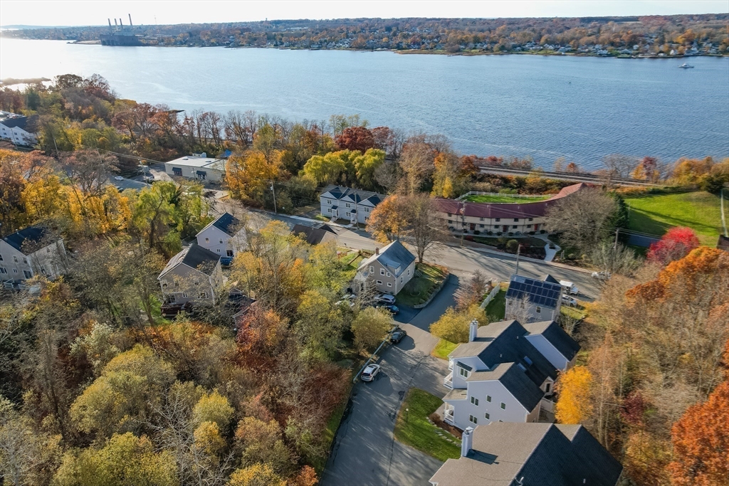 3853 North Main Street Fall River, MA 02720 - Photo 26 of 38 an aerial view of a house with a lake view