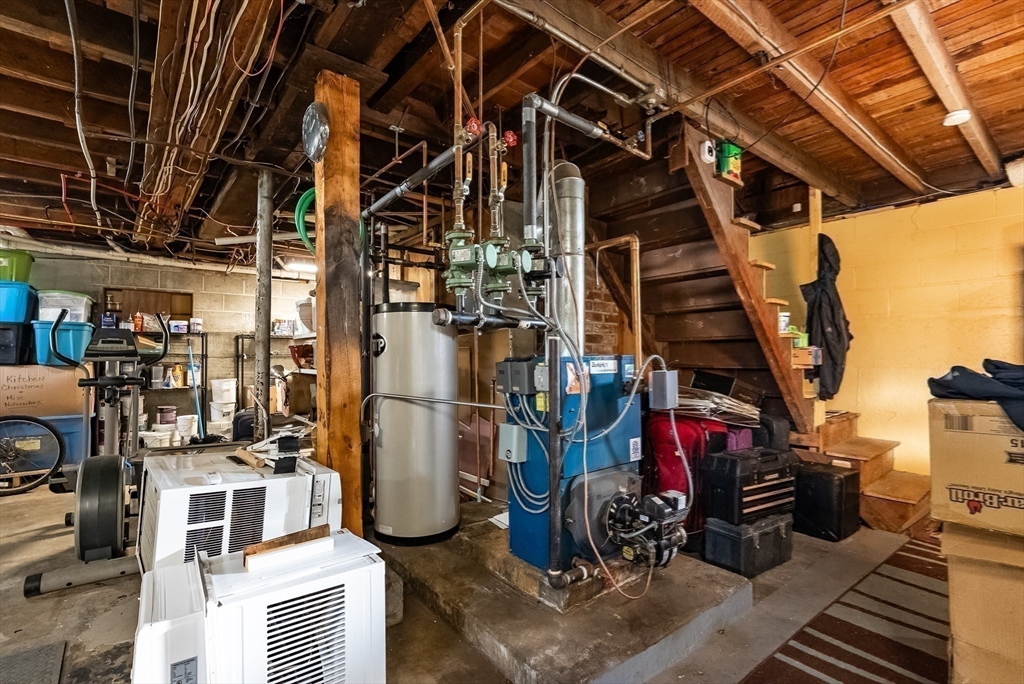 3853 North Main Street Fall River, MA 02720 - Photo 30 of 38 a view of a storage room with washer and dryer