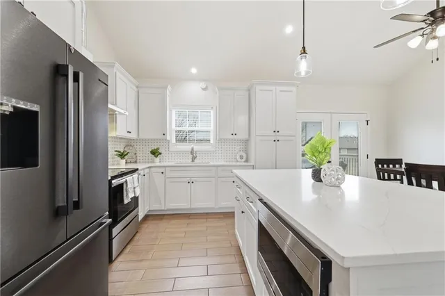 $350,000 | 405 South Monroe Street, Raymore, MO 64083