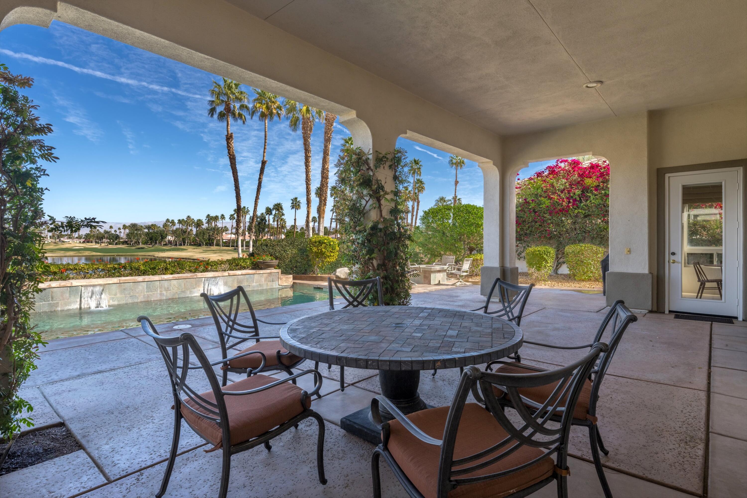 81100 Legends Way La Quinta, CA 92253 - Photo 11 of 37 a view of a chairs and table in the patio