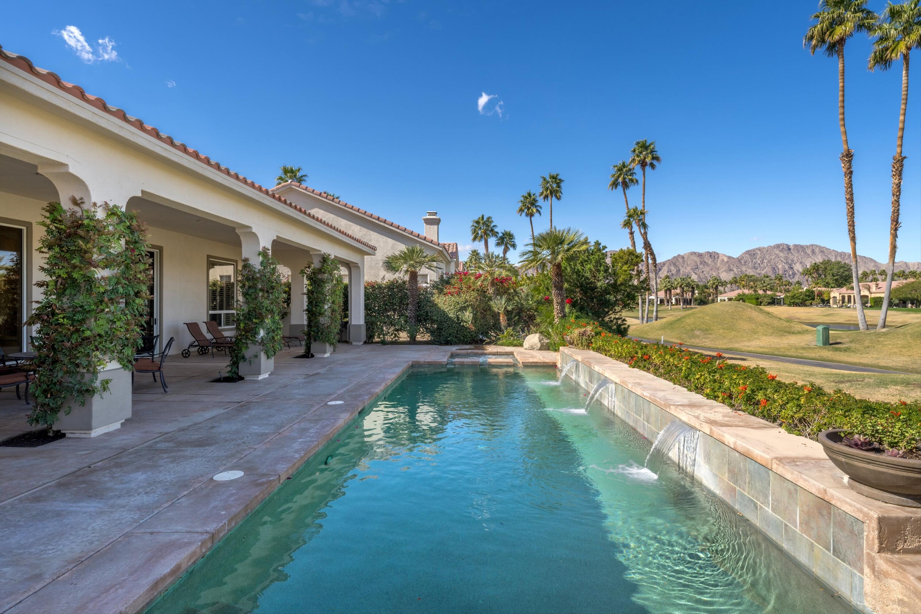 81100 Legends Way La Quinta, CA 92253 - Photo 14 of 37 a view of a swimming pool with a patio