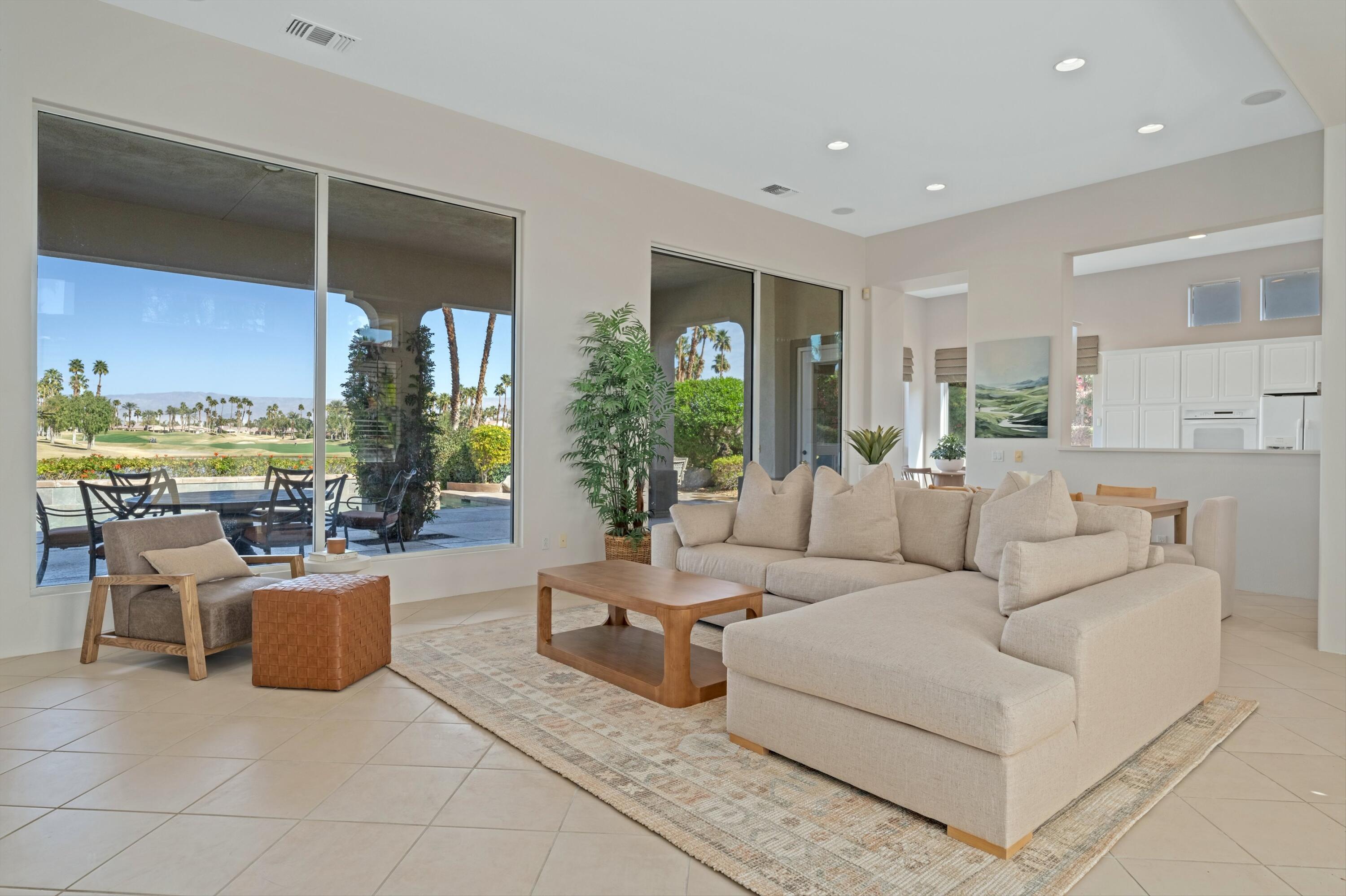 81100 Legends Way La Quinta, CA 92253 - Photo 18 of 37 a living room with furniture and a floor to ceiling window
