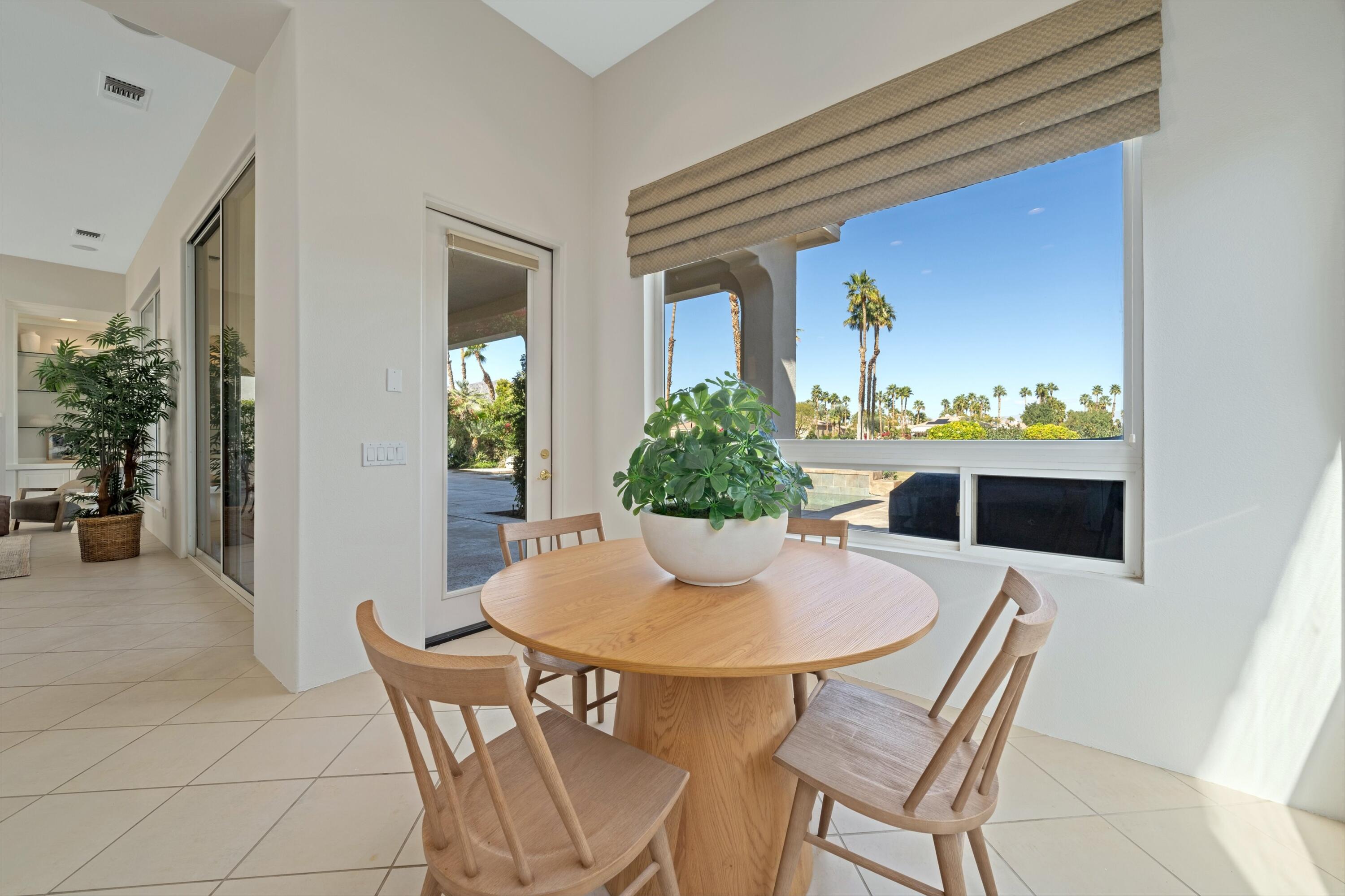 81100 Legends Way La Quinta, CA 92253 - Photo 25 of 37 a dining room with furniture and wooden floor