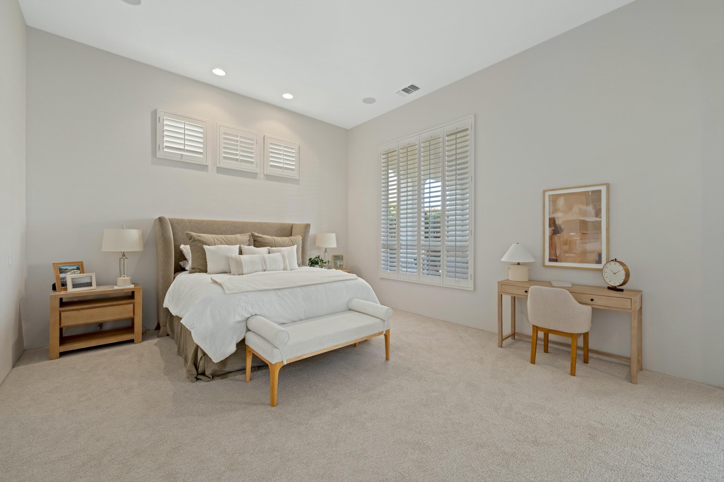 81100 Legends Way La Quinta, CA 92253 - Photo 28 of 37 a bedroom with a bed and a chair