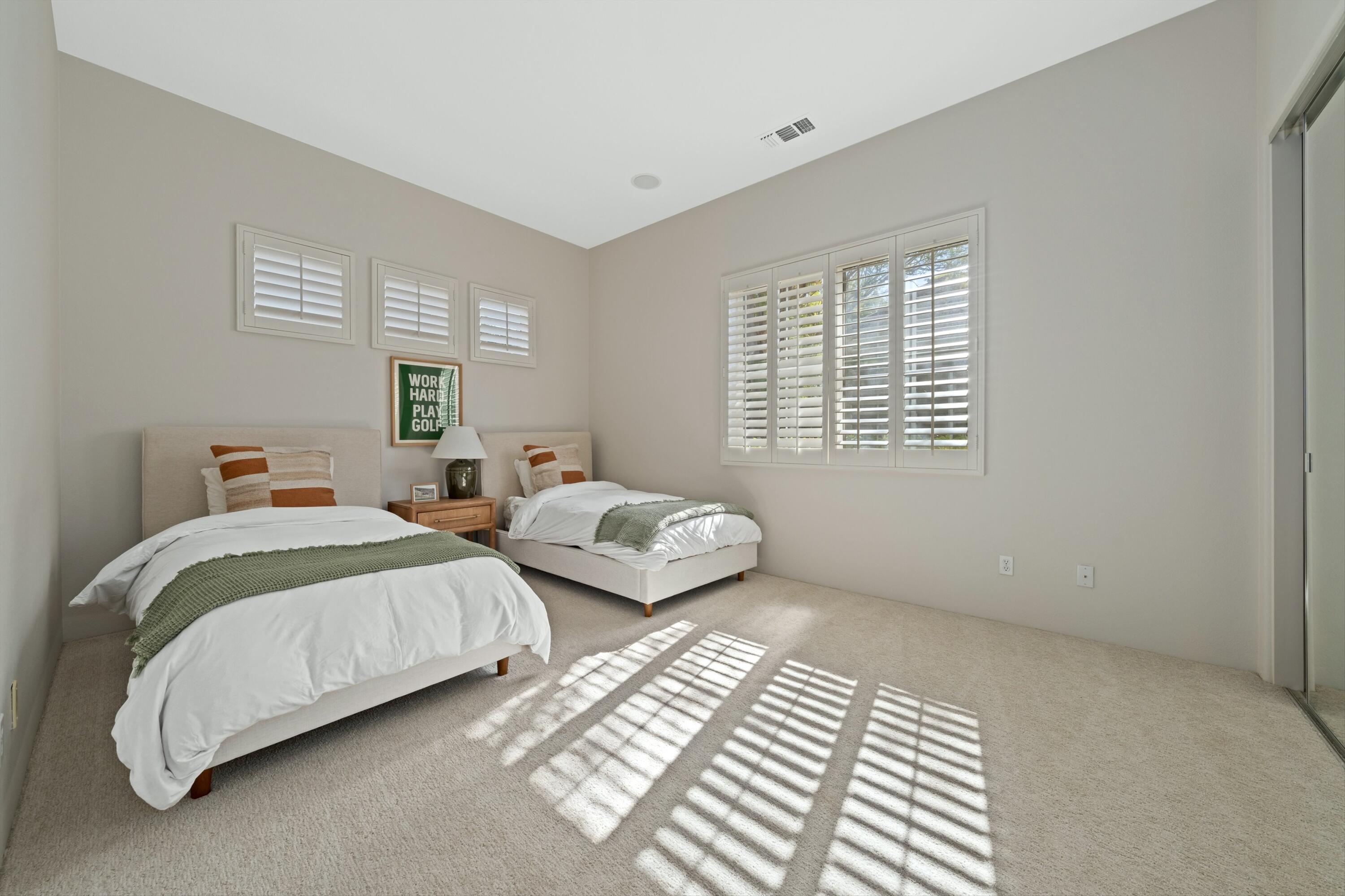 81100 Legends Way La Quinta, CA 92253 - Photo 32 of 37 a bedroom with two beds and a window