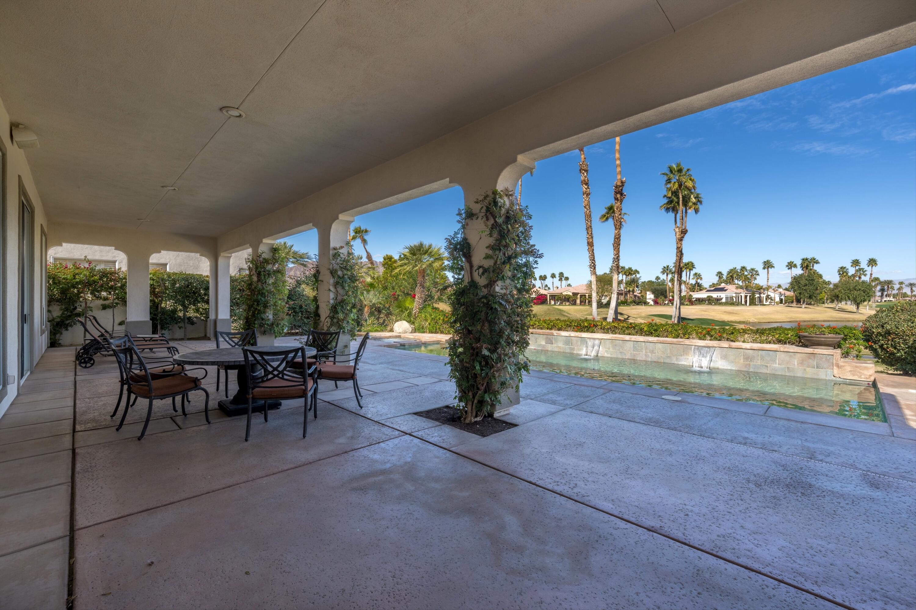 81100 Legends Way La Quinta, CA 92253 - Photo 10 of 37 a view of a swimming pool and outdoor seating