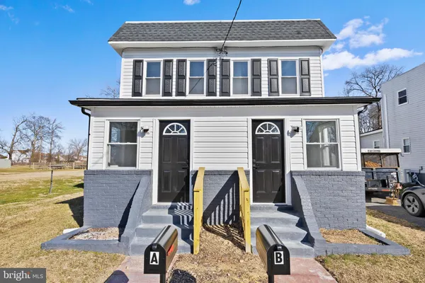 a view of a house with backyard porch and furniture