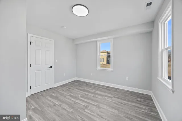 an empty room with windows