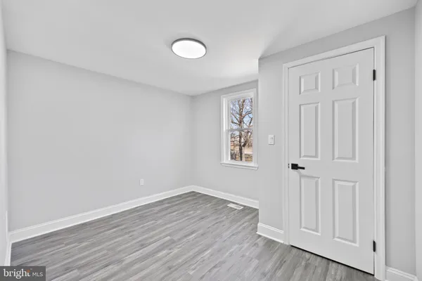a view of a livingroom with wooden floor