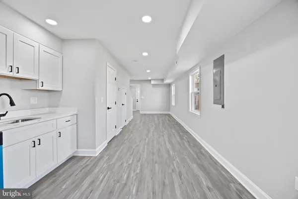 a view of a kitchen with wooden floor
