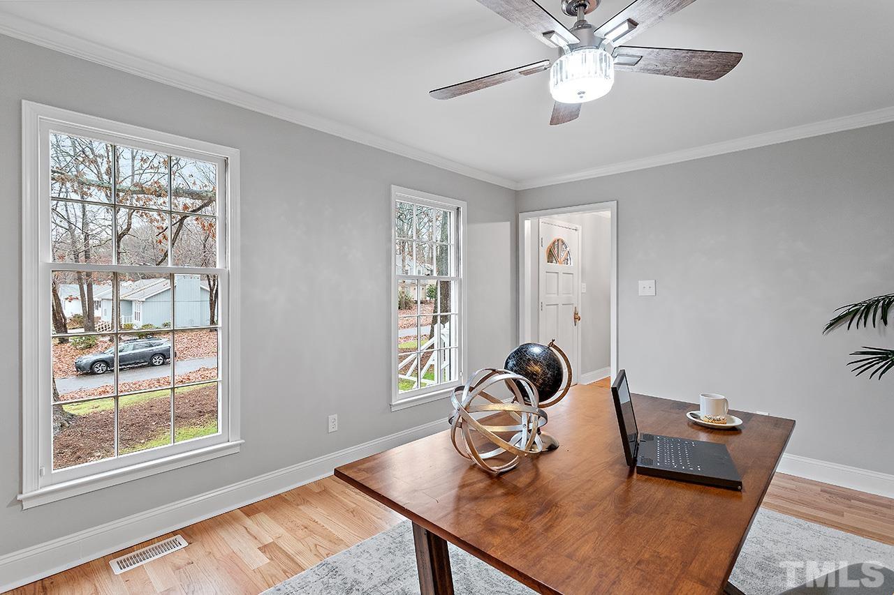 2800 Pidgeon Hill Road Raleigh, NC 27613 - Photo 11 of 35 a view of a workspace with furniture and a window