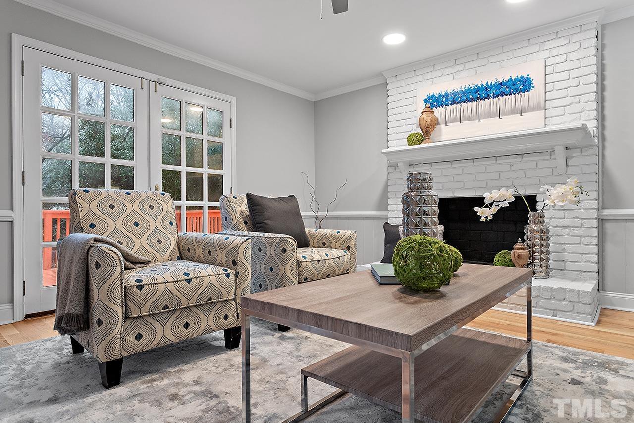 2800 Pidgeon Hill Road Raleigh, NC 27613 - Photo 14 of 35 a living room with furniture and a fireplace