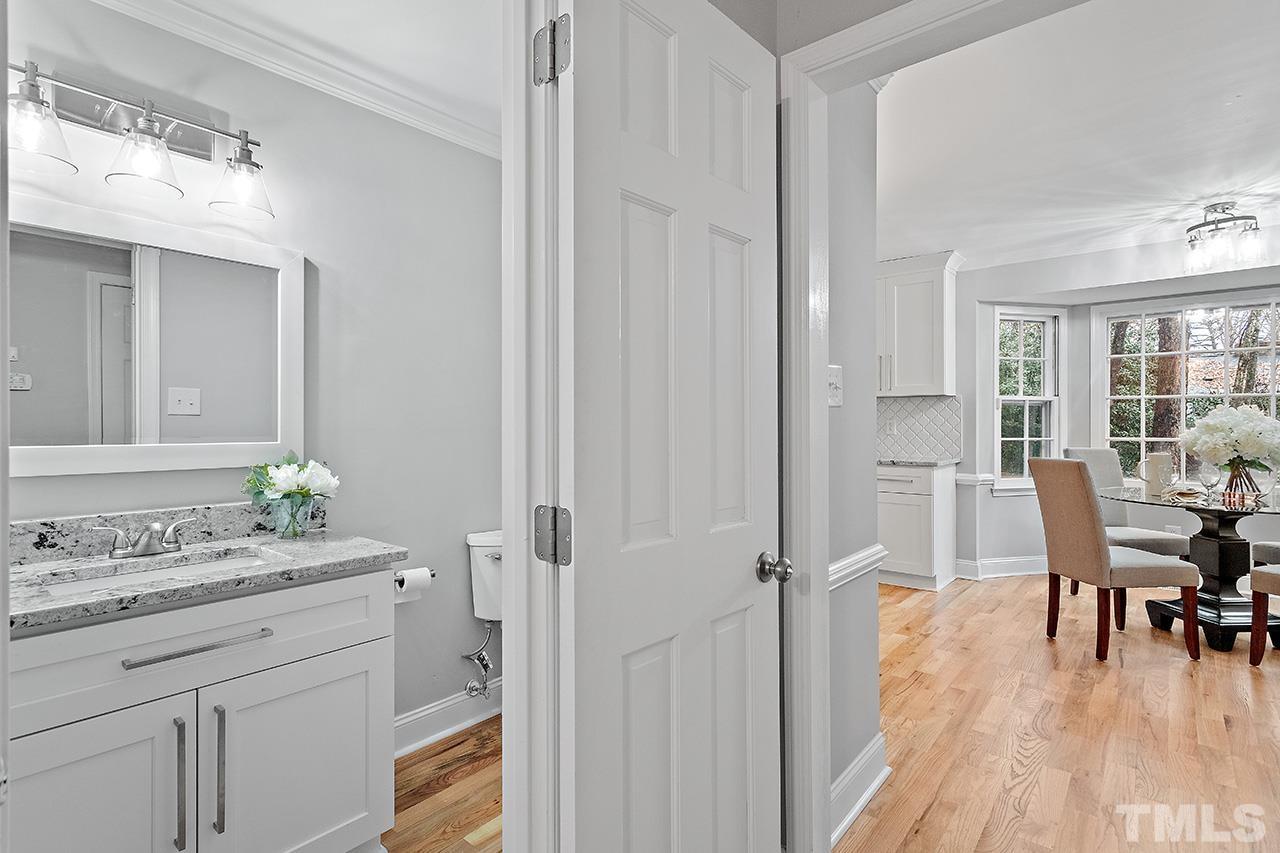 2800 Pidgeon Hill Road Raleigh, NC 27613 - Photo 15 of 35 a view of bathroom with a sink toilet and wooden floor