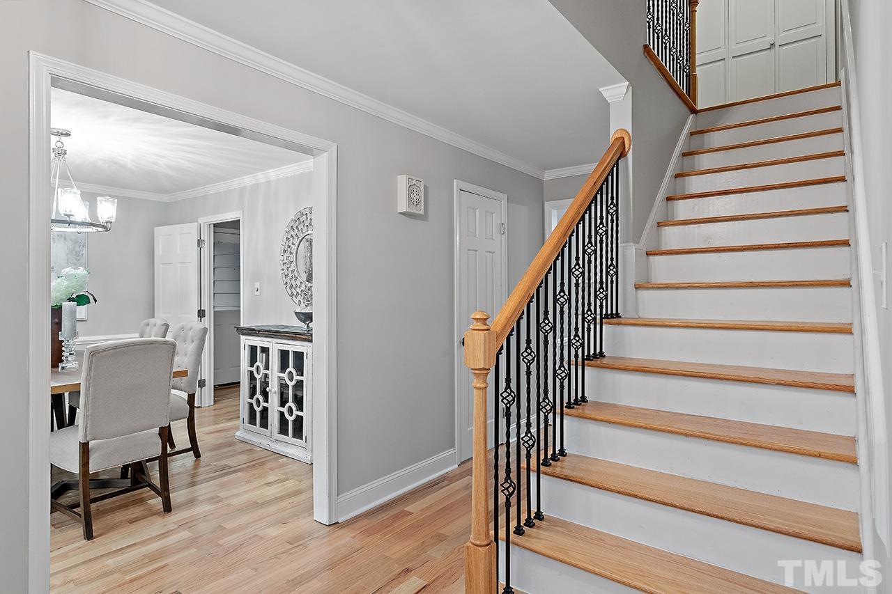 2800 Pidgeon Hill Road Raleigh, NC 27613 - Photo 16 of 35 a view of entryway with dining room and wooden floor
