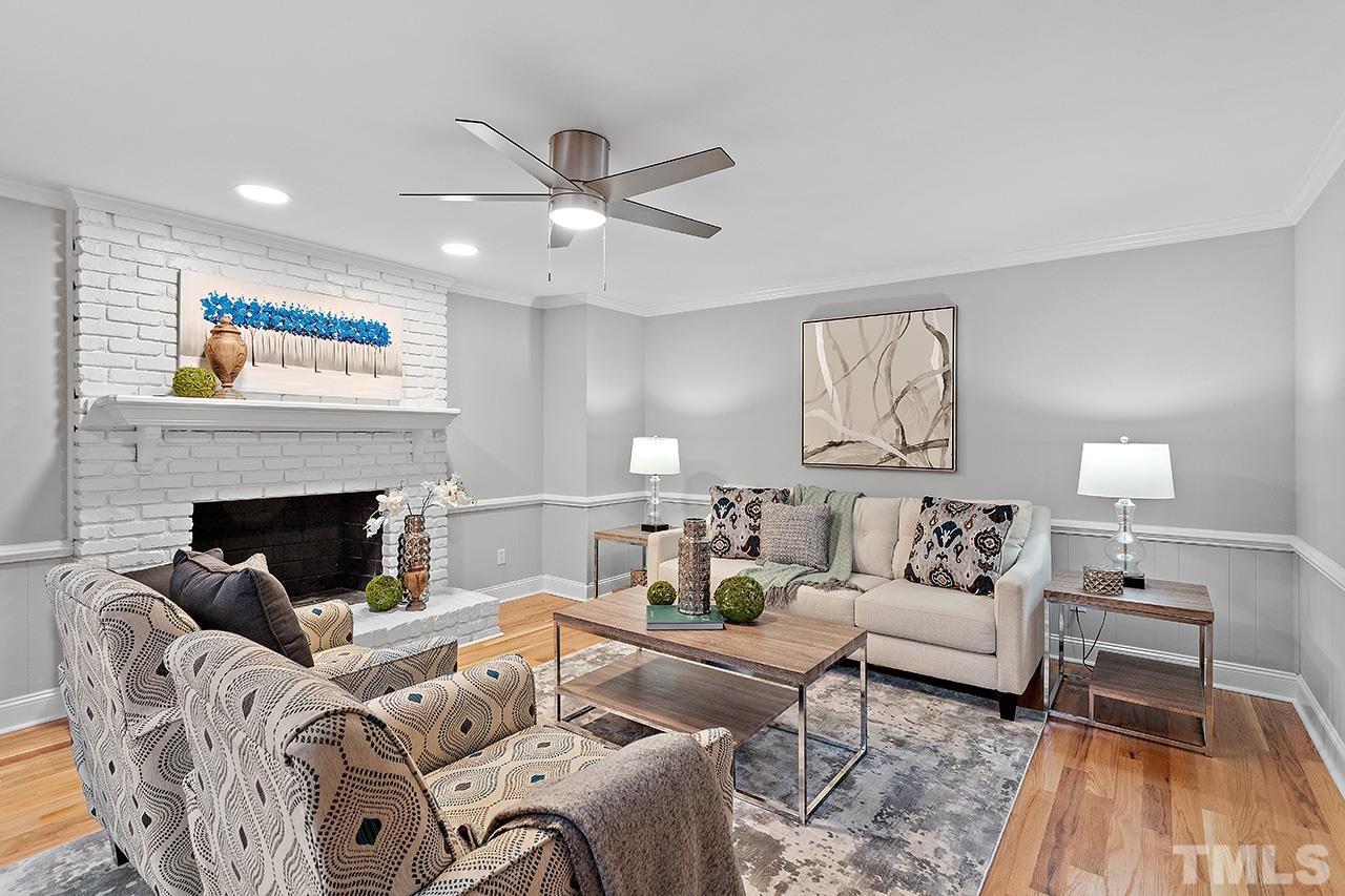 2800 Pidgeon Hill Road Raleigh, NC 27613 - Photo 2 of 35 a living room with furniture and a fireplace