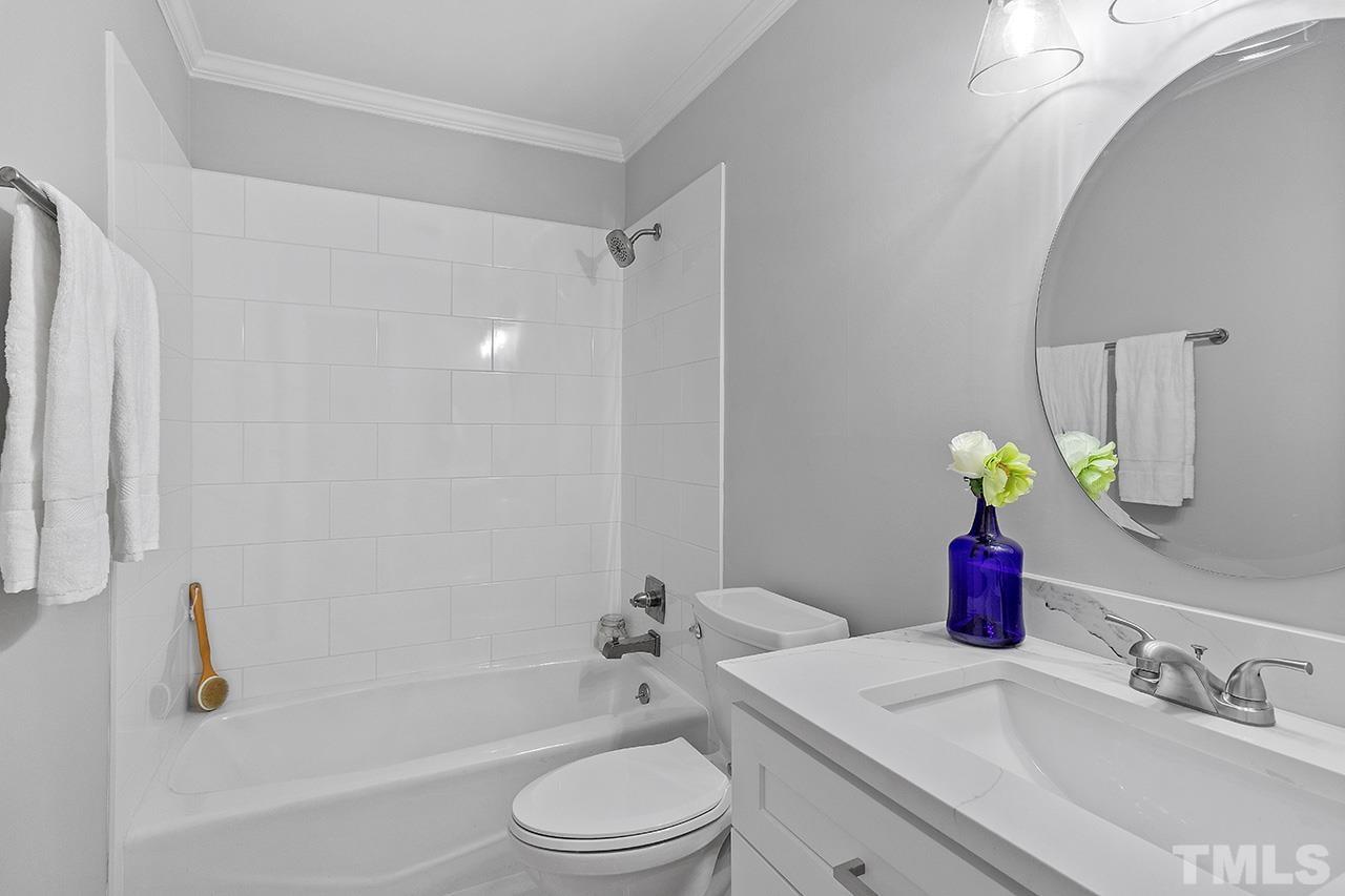 2800 Pidgeon Hill Road Raleigh, NC 27613 - Photo 24 of 35 a bathroom with a sink toilet and shower