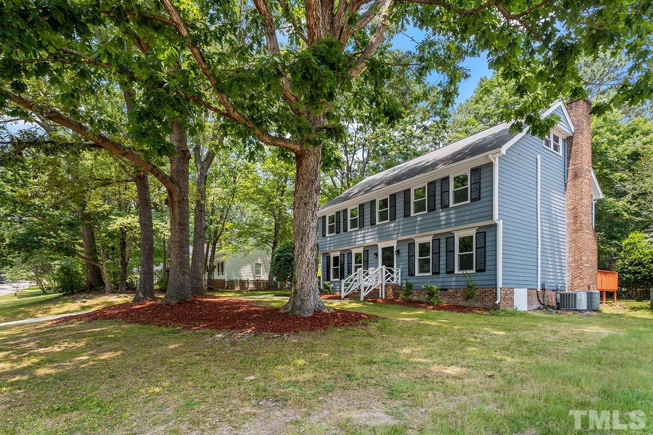 2800 Pidgeon Hill Road Raleigh, NC 27613 - Photo 27 of 35 a front view of a house with a garden and trees