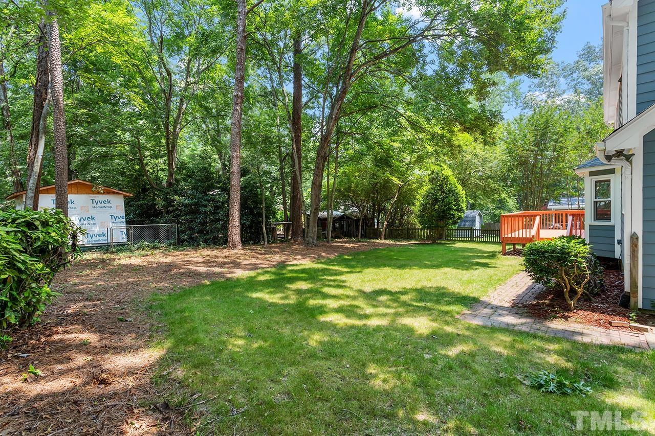 2800 Pidgeon Hill Road Raleigh, NC 27613 - Photo 31 of 35 a backyard of a house with lots of green space