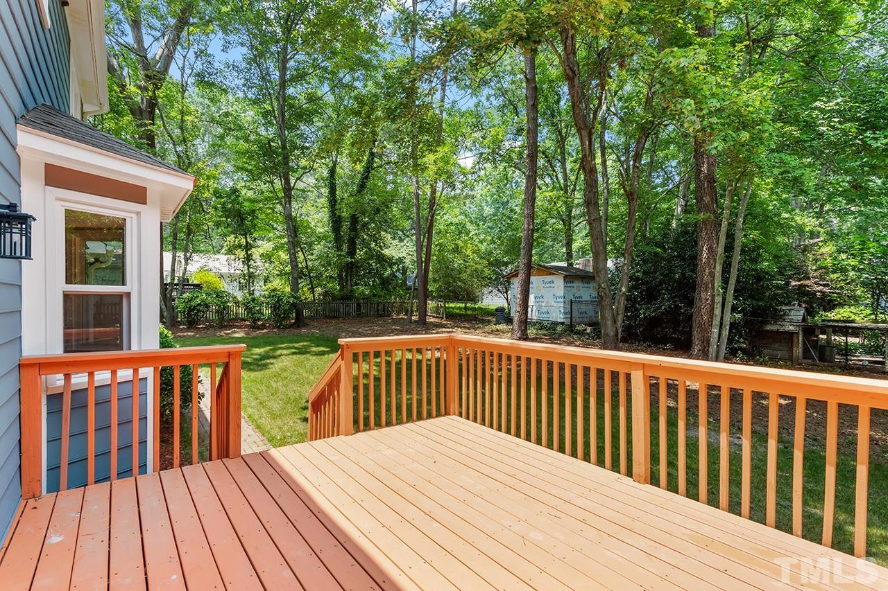 2800 Pidgeon Hill Road Raleigh, NC 27613 - Photo 34 of 35 a balcony with wooden floor and outdoor space