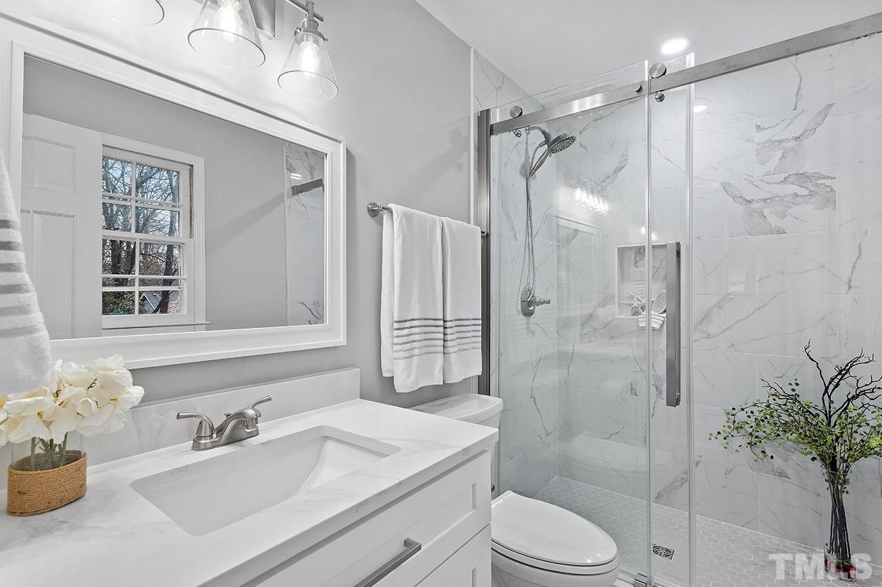 2800 Pidgeon Hill Road Raleigh, NC 27613 - Photo 7 of 35 a bathroom with a sink toilet tub and shower
