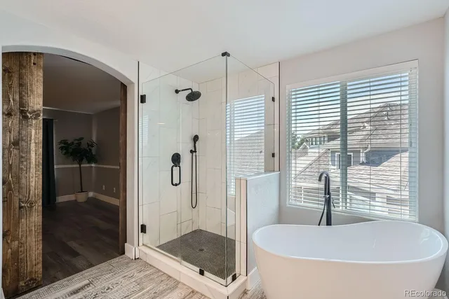a bathroom with a tub and shower
