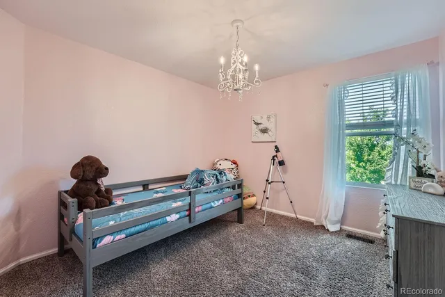 a bedroom with bed and a window