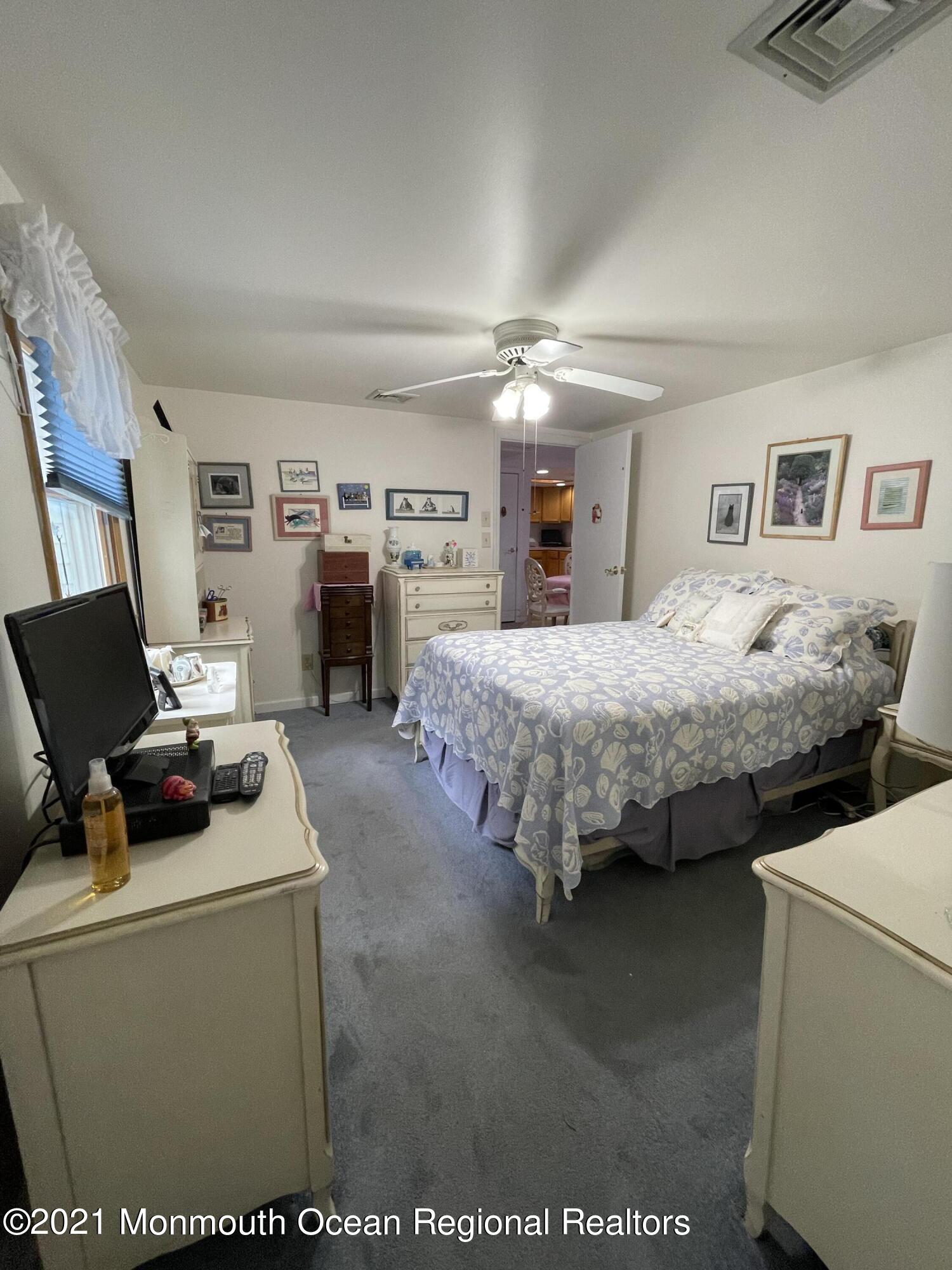 84 Club House Road Brick, NJ 08723 - Photo 11 of 28 a bedroom with bed and a couch