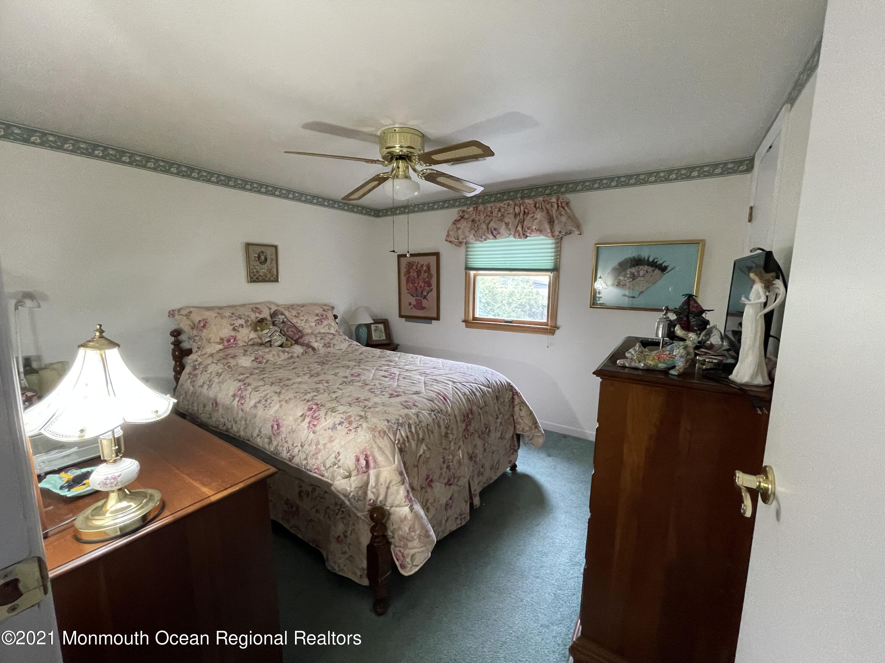 84 Club House Road Brick, NJ 08723 - Photo 14 of 28 a bedroom with a bed and window