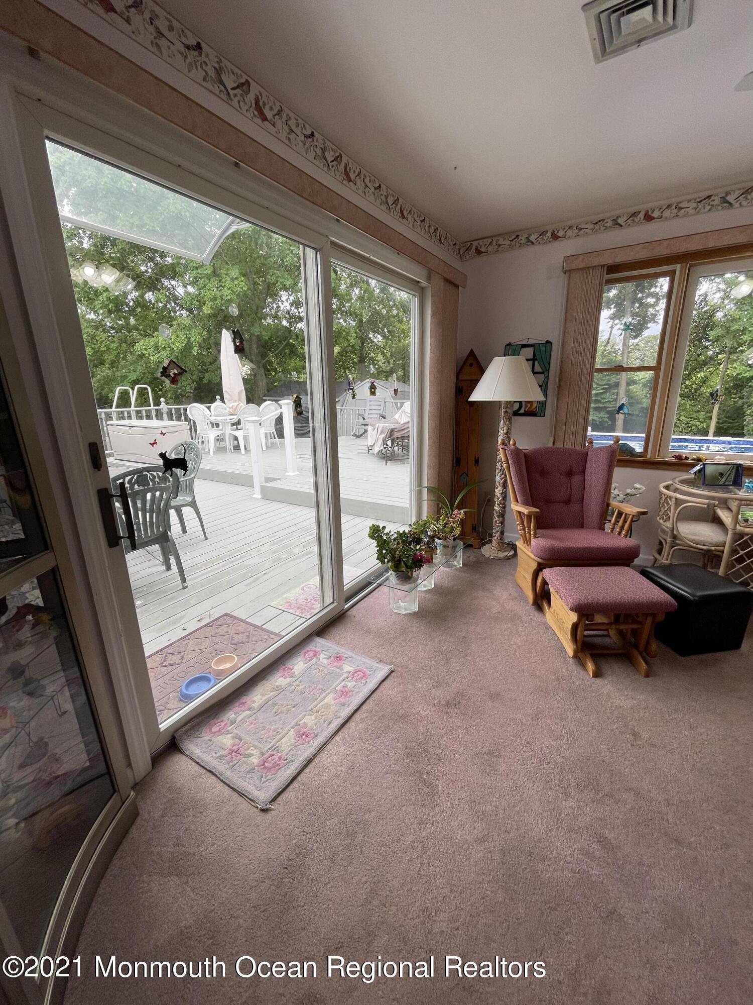 84 Club House Road Brick, NJ 08723 - Photo 18 of 28 a living room with furniture and a large window