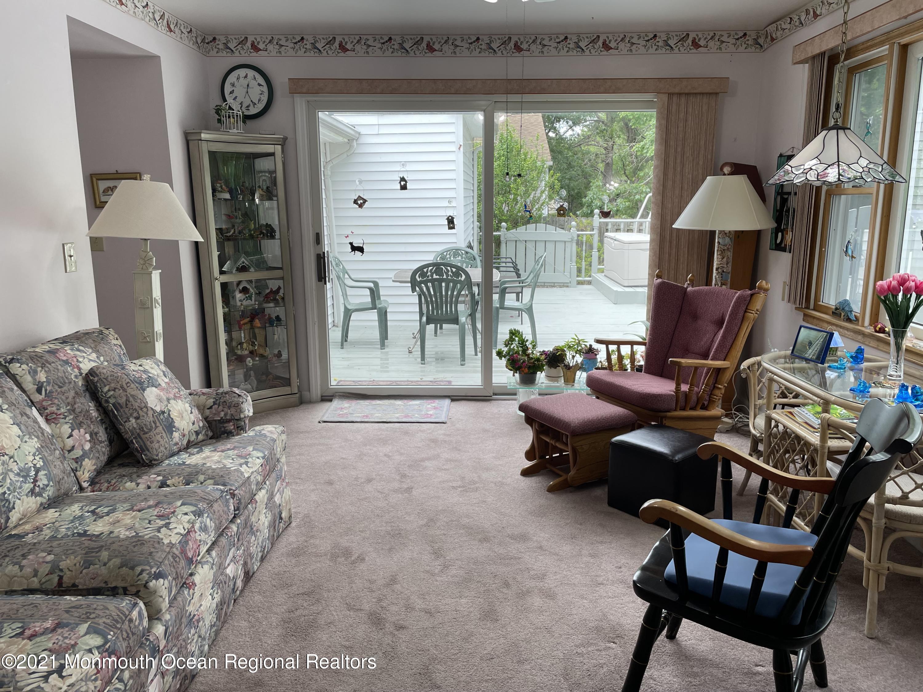 84 Club House Road Brick, NJ 08723 - Photo 20 of 28 a living room with furniture and a flat screen tv