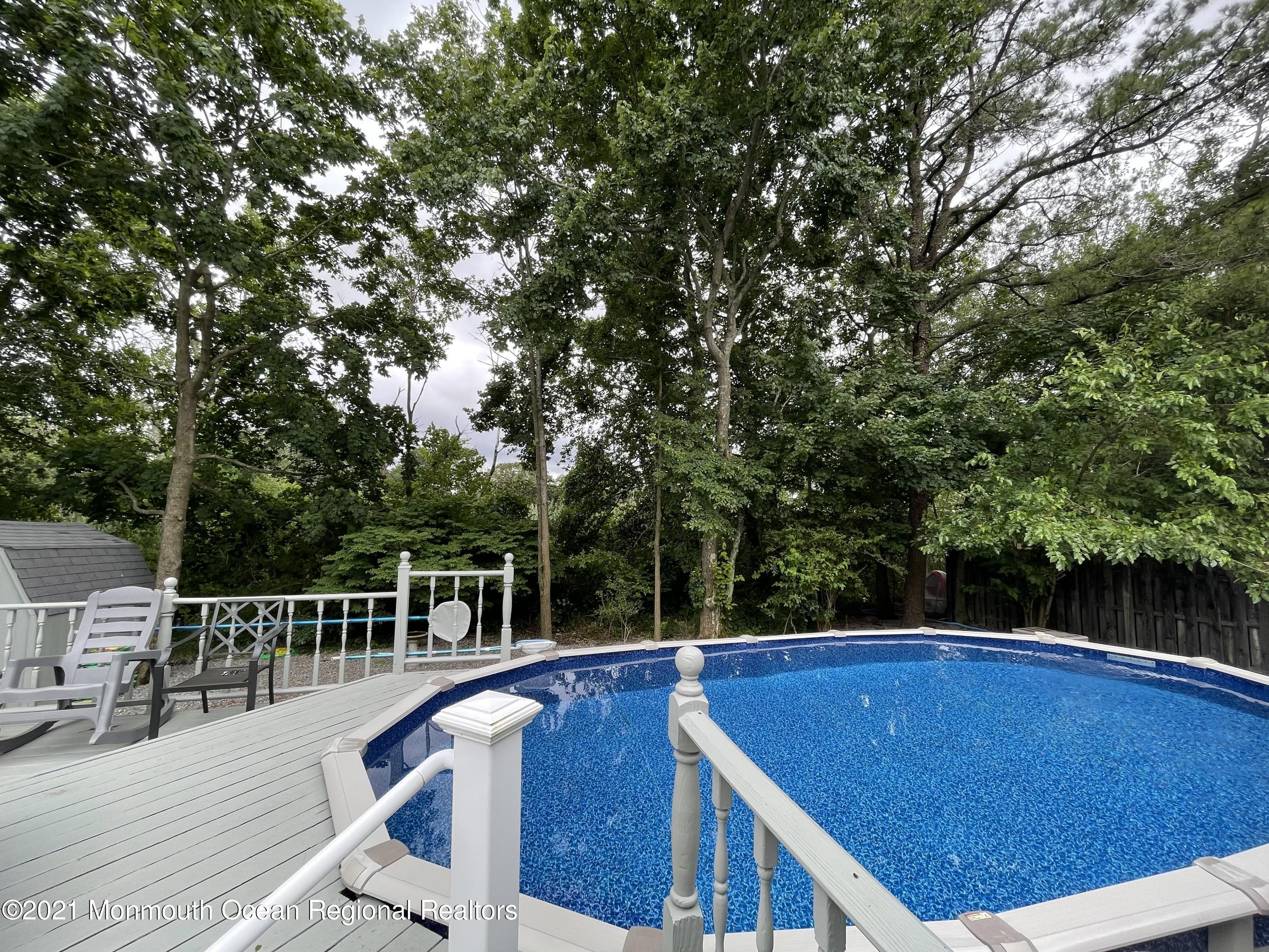 84 Club House Road Brick, NJ 08723 - Photo 23 of 28 a view of balcony with wooden floor and seating space