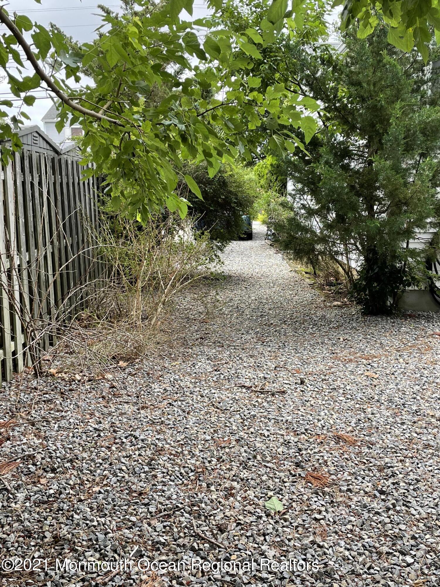 84 Club House Road Brick, NJ 08723 - Photo 26 of 28 a view of a yard with plants and trees