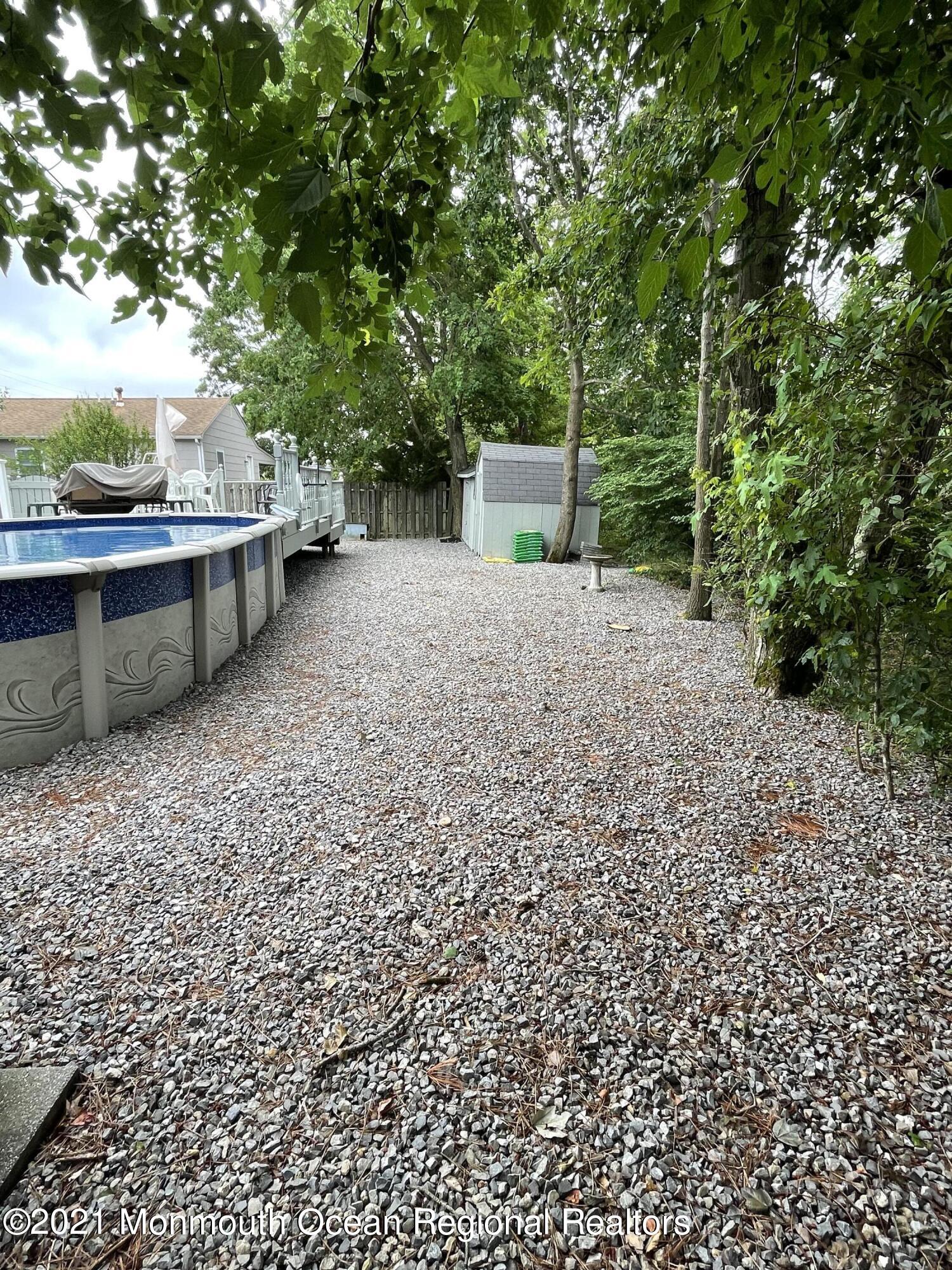 84 Club House Road Brick, NJ 08723 - Photo 28 of 28 a view of a backyard with large trees