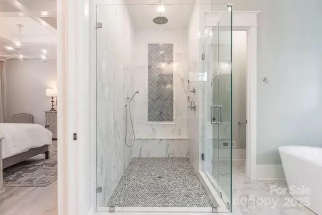a bathroom with a glass shower door