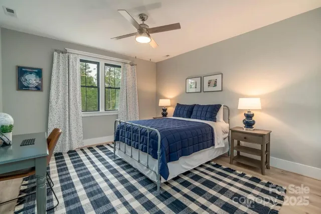 a bedroom with a large bed and a window