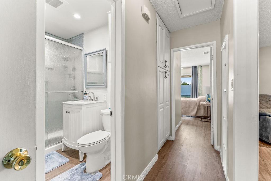 3540 Cannes Avenue Riverside, CA 92501 - Photo 11 of 32 a bathroom with a toilet a sink and a mirror