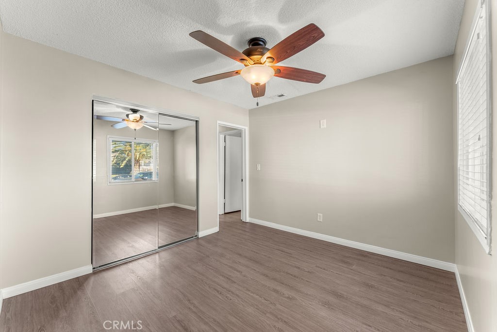 3540 Cannes Avenue Riverside, CA 92501 - Photo 16 of 32 an empty room with fan and windows