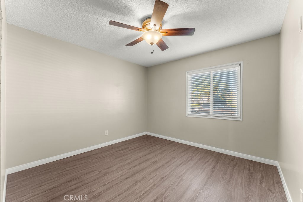 3540 Cannes Avenue Riverside, CA 92501 - Photo 17 of 32 wooden floor in an empty room with a window