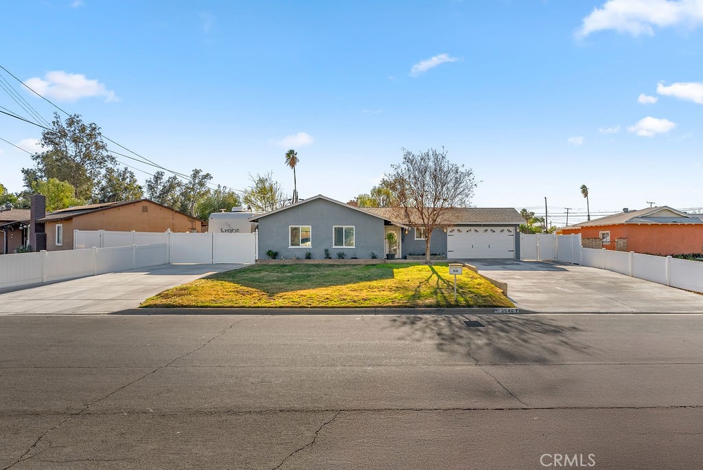 3540 Cannes Avenue Riverside, CA 92501 - Photo 2 of 32 a swimming pool with outdoor seating