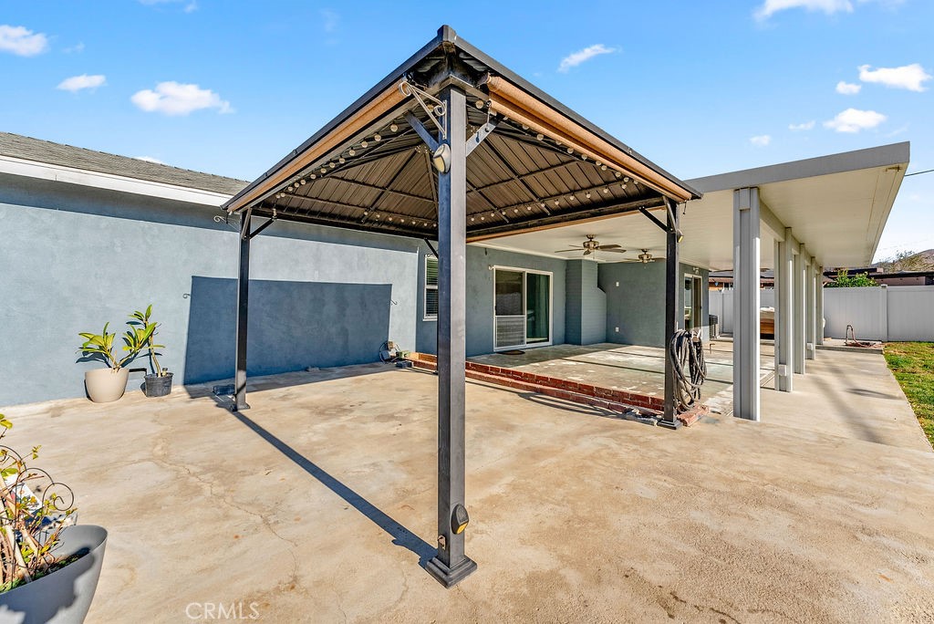 3540 Cannes Avenue Riverside, CA 92501 - Photo 28 of 32 a patio with a table and chairs